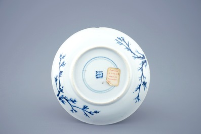 A blue and white Chinese cup and saucer with "The crucifixion", Kangxi