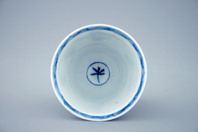 A blue and white Chinese cup and saucer with "The crucifixion", Kangxi