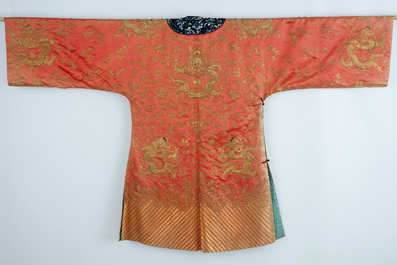 A Chinese orange ground silk embroidered dragon robe, 19th C.