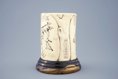 A Japanese carved and signed ivory brushpot on gilt-lacquered stand, Meiji, 19th C.