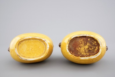 A pair of Chinese yellow glazed hu-shaped vases on stand, 19/20th C.