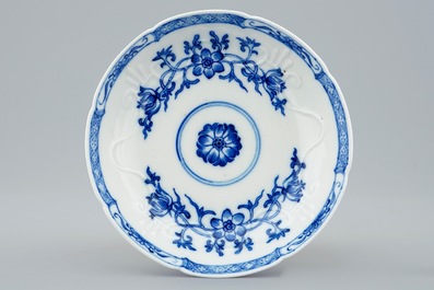 A Chinese blue and white soft paste  moulded cup and saucer, Qianlong, 18th C.