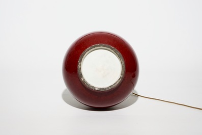 A Chinese monochrome red bottle vase mounted as a lamp, 19th C.