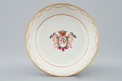 A Chinese famille rose cup and saucer with cherubs, Qianlong, 18th C.