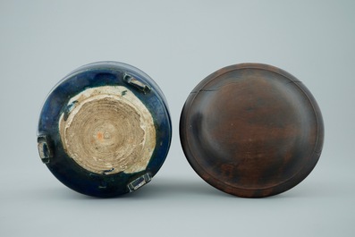 A Chinese monochrome blue cylincrical tripod incense burner with wood lid, 19th C.