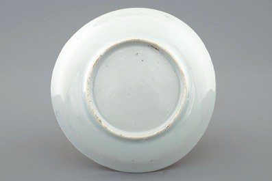 A Chinese blue and white on coral ground cup and saucer, Kangxi
