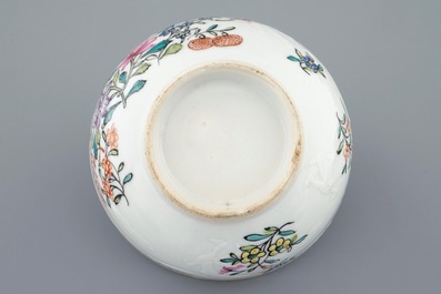 A Chinese clobbered blanc de chine cup and saucer with moulded dragon design, 18th C.