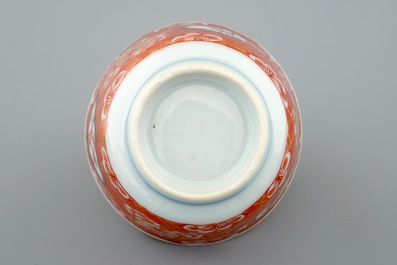 A Chinese blue and white on coral ground cup and saucer, Kangxi