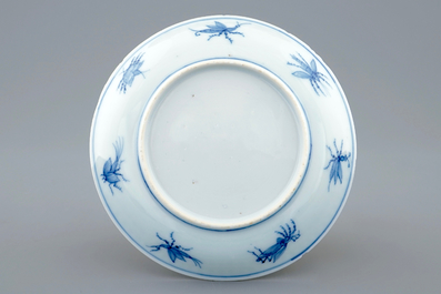 A Chinese blue and white cup and saucer with "La Dame au Parasol" after Pronk, ca. 1740