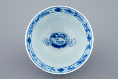A Chinese blue and white cup and saucer with "La Dame au Parasol" after Pronk, ca. 1740