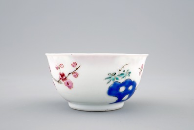 Een Chinese famille rose eierschaal kop en schotel met een tuinsc&egrave;ne, Yongzheng, 1723-1735