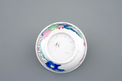 Een Chinese famille rose eierschaal kop en schotel met een tuinsc&egrave;ne, Yongzheng, 1723-1735