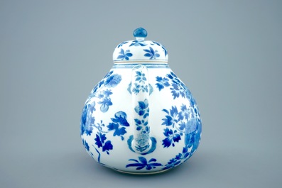 A large Chinese blue and white teapot and cover with peacocks, Kangxi