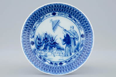 A Chinese blue and white cup and saucer with "La Dame au Parasol" after Pronk, ca. 1740