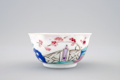Een Chinese famille rose eierschaal kop en schotel met een tuinsc&egrave;ne, Yongzheng, 1723-1735
