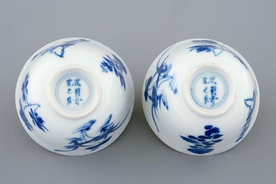 A pair of Chinese blue and white wine cups with 4 floral patterns, six-character mark, Kangxi
