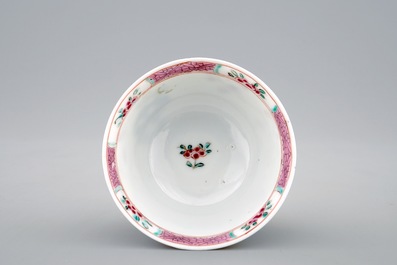 Een Chinese famille rose eierschaal kop en schotel met een tuinsc&egrave;ne, Yongzheng, 1723-1735