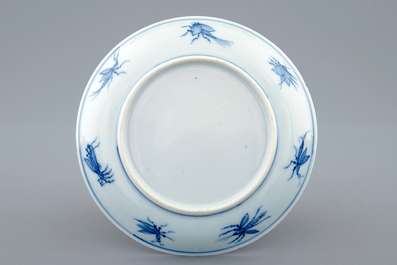 A Chinese blue and white cup and saucer with "La Dame au Parasol" after Pronk, ca. 1740