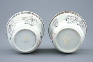 A pair of Chinese grisaille and gilt cups and saucers with immortals, Qianlong, 18th C.