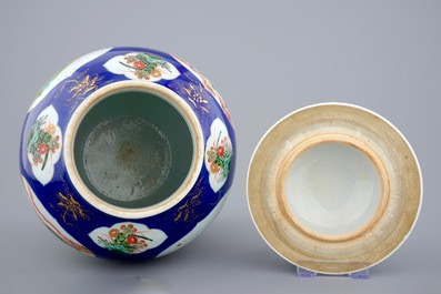 A Chinese famille verte powder blue ground vase and cover, 19th C.