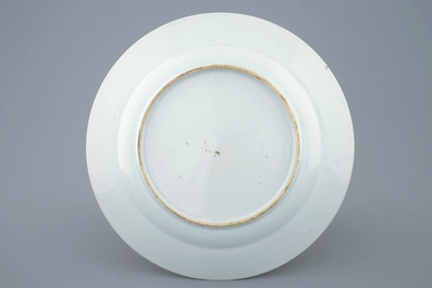 A Chinese famille rose plate with figures in a garden, Yongzheng, 1723-1735