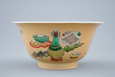 A Chinese famille verte caf&eacute; au lait ground bowl with precious objects, Kangxi