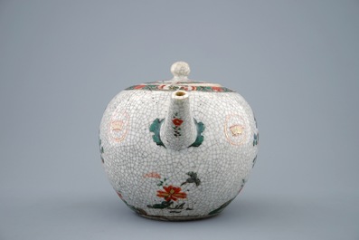 A Chinese famille verte crackle glazed ground teapot and cover, Kangxi