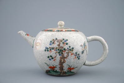 A Chinese famille verte crackle glazed ground teapot and cover, Kangxi
