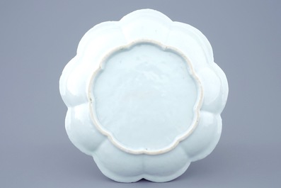 A Chinese moulded and applied famille rose teapot and cover on stand, Yongzheng, 1723-1735