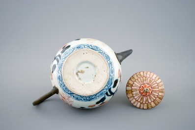 A Japanese Imari teapot and cover with replaced spout and handle, 18th C.