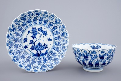 Three Chinese blue and white plates and a lotus shaped cup and saucer, Kangxi