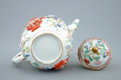 A Chinese relief-decorated famille rose teapot and cover, Yongzheng, 1723-1735