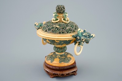 A Chinese polychrome ivory censer with cover on wooden base, 19th C.