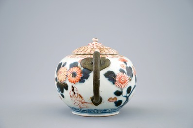 A Japanese Imari teapot and cover with replaced spout and handle, 18th C.
