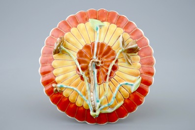 A Chinese relief-decorated grisaille and iron red cup and saucer with matching bowl, Yongzheng, 1723-1735