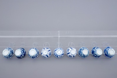 A collection of 9 Chinese blue and white cups and saucers, Kangxi