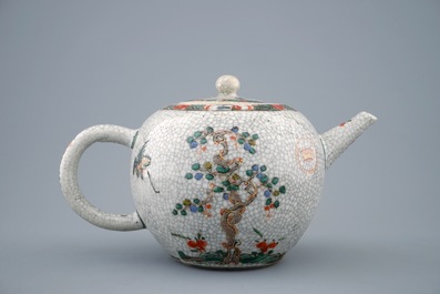 A Chinese famille verte crackle glazed ground teapot and cover, Kangxi