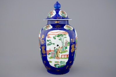 A Chinese famille verte powder blue ground vase and cover, 19th C.