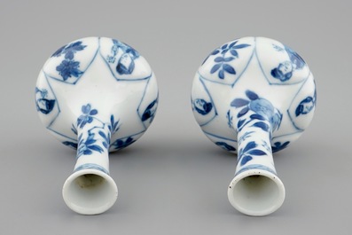 A pair of Chinese blue and white bottle shaped vases with long Elizas, Kangxi