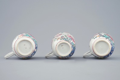 A set of three Chinese famille rose cups and saucers with bords among flowers, Yongzheng/Qianlong