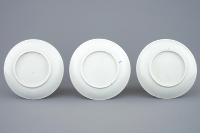 A set of three Chinese famille rose cups and saucers with bords among flowers, Yongzheng/Qianlong