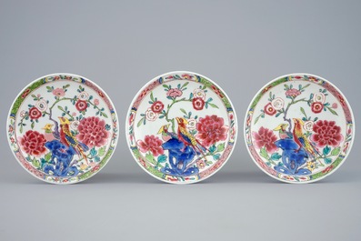 A set of three Chinese famille rose cups and saucers with bords among flowers, Yongzheng/Qianlong