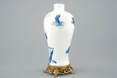 A Chinese blue and white meiping vase on gilt bronze stand, 19th C.