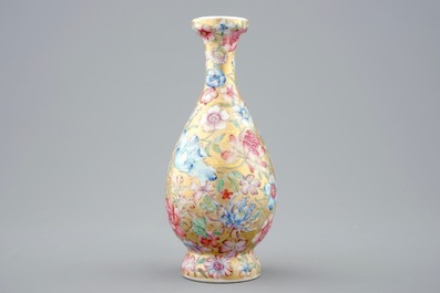 A Chinese gilt-ground famille rose millefleurs vase, 19/20th C.