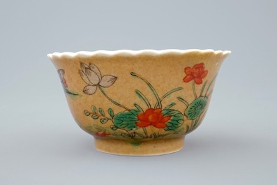 A Chinese famille verte and caf&eacute; au lait cup and saucer, Kangxi