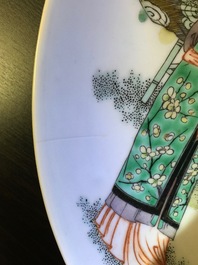 A Chinese famille verte plate with ladies playing music, 19th C.