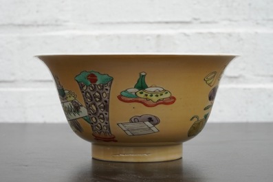 A Chinese famille verte caf&eacute; au lait ground bowl with precious objects, Kangxi