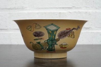 A Chinese famille verte caf&eacute; au lait ground bowl with precious objects, Kangxi