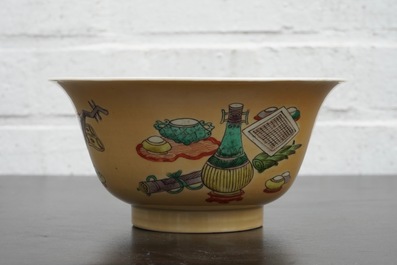 A Chinese famille verte caf&eacute; au lait ground bowl with precious objects, Kangxi