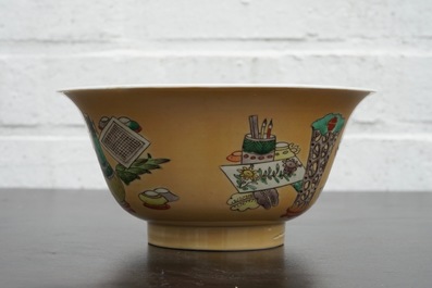 A Chinese famille verte caf&eacute; au lait ground bowl with precious objects, Kangxi